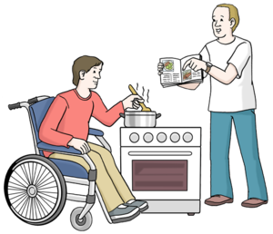  Immagine di una persona in sedia a rotelle che cucina mentre un assistente gli mostra il libro delle ricette